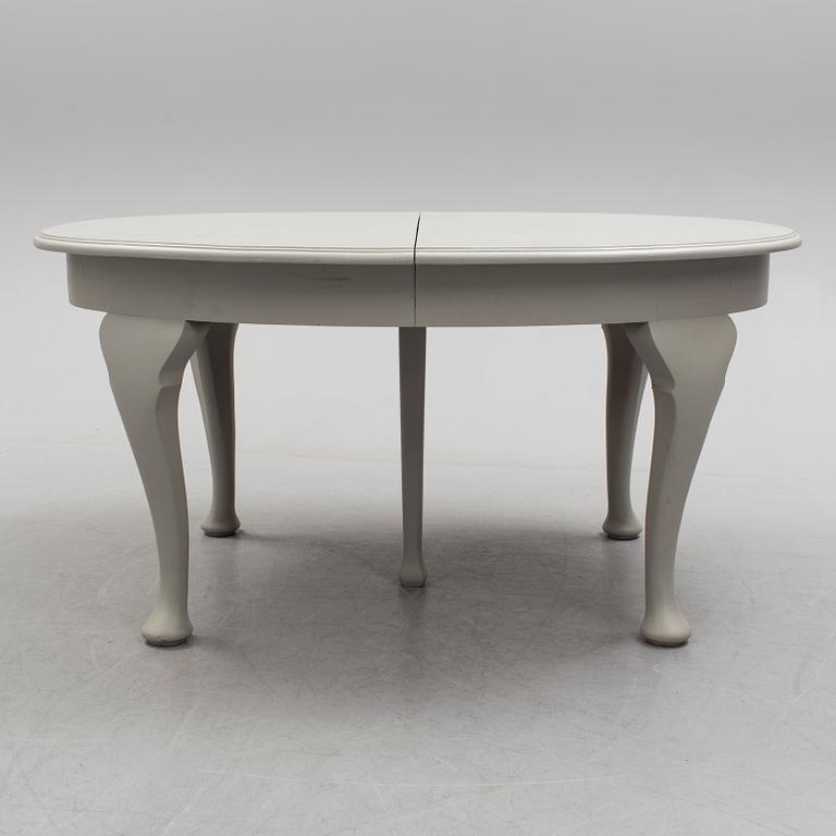 A painted Rococo style dining table, circa 1900.