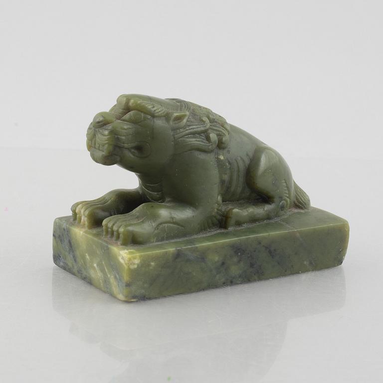 A Chinese stone figure of a lion, 20th century.