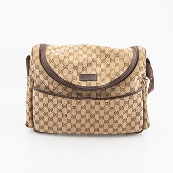 A Gucci diaper bag.