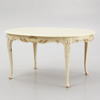 A Rococo style Dining Table with Chairs, first half of the 20th Century.