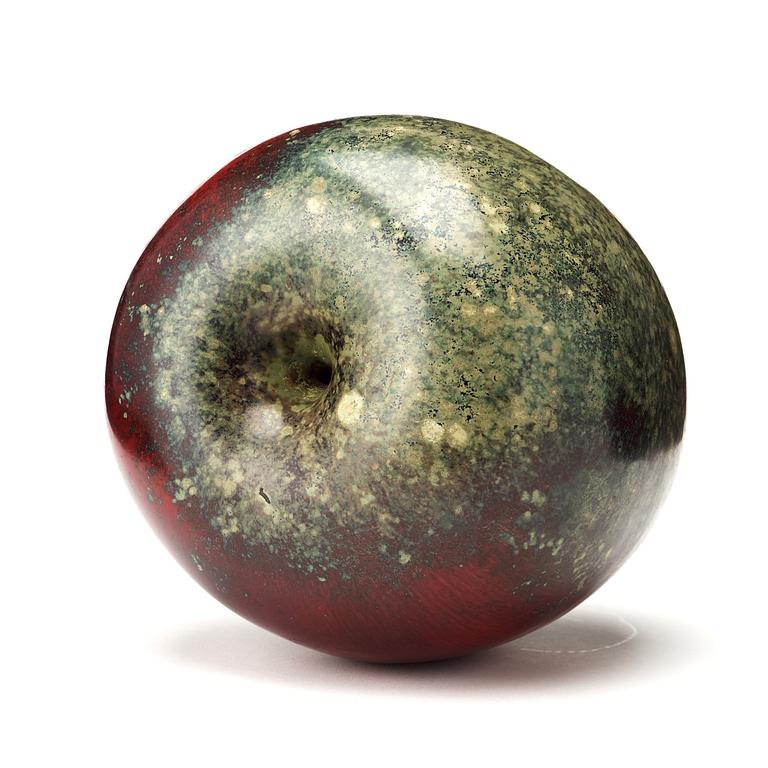 Hans Hedberg, a faience sculpture of a red and green glazed apple, Biot, France.