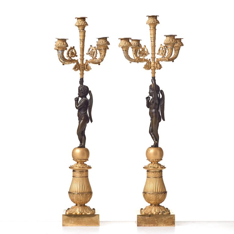 A pair of French Empire early 19th century five-light candlesticks.