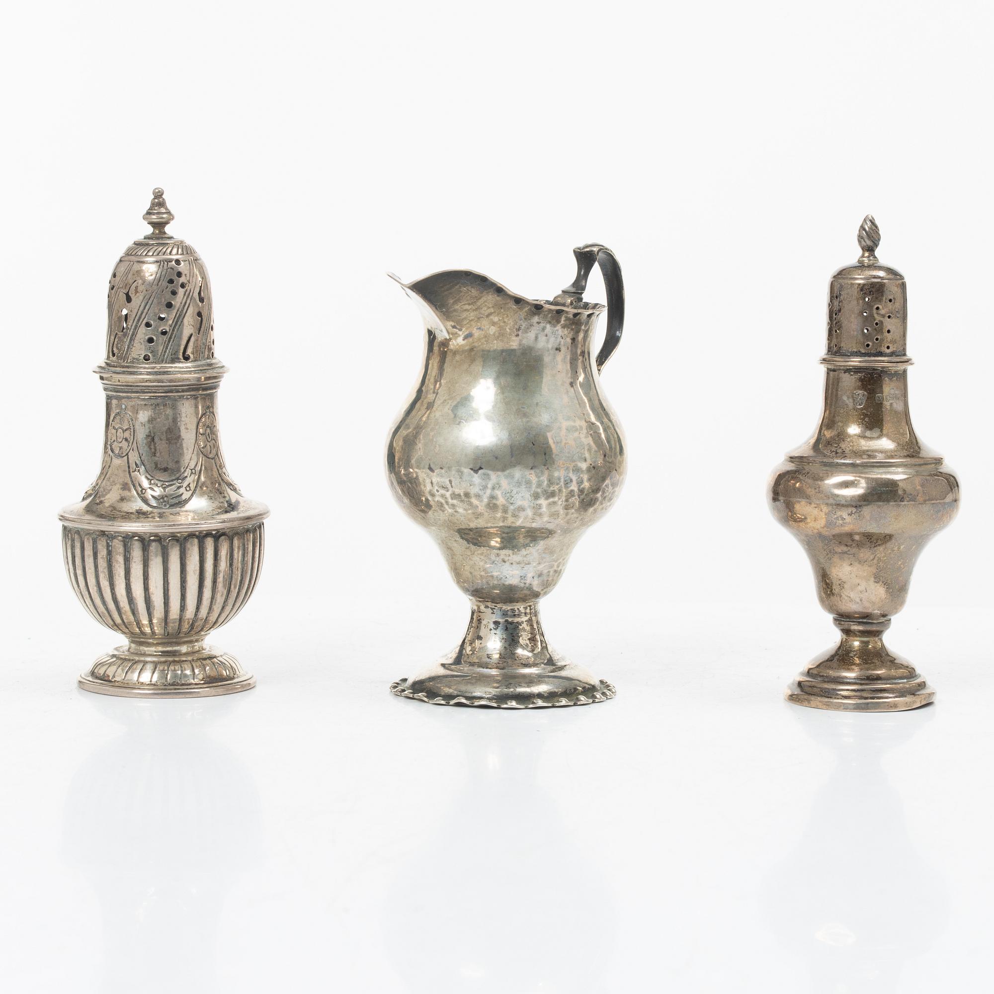 Two silver casters and cream jug, England.