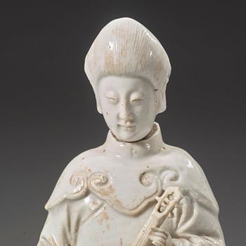 A blanc de chine figure of a court attendant, Qing dynasty, Kangxi ca 1690.