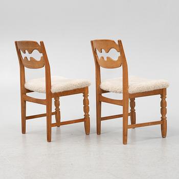 Henning Kjærnulf, a set of six oak 'razorblade' chairs, with new sheepskin upholstery, for EGK, 1960s.