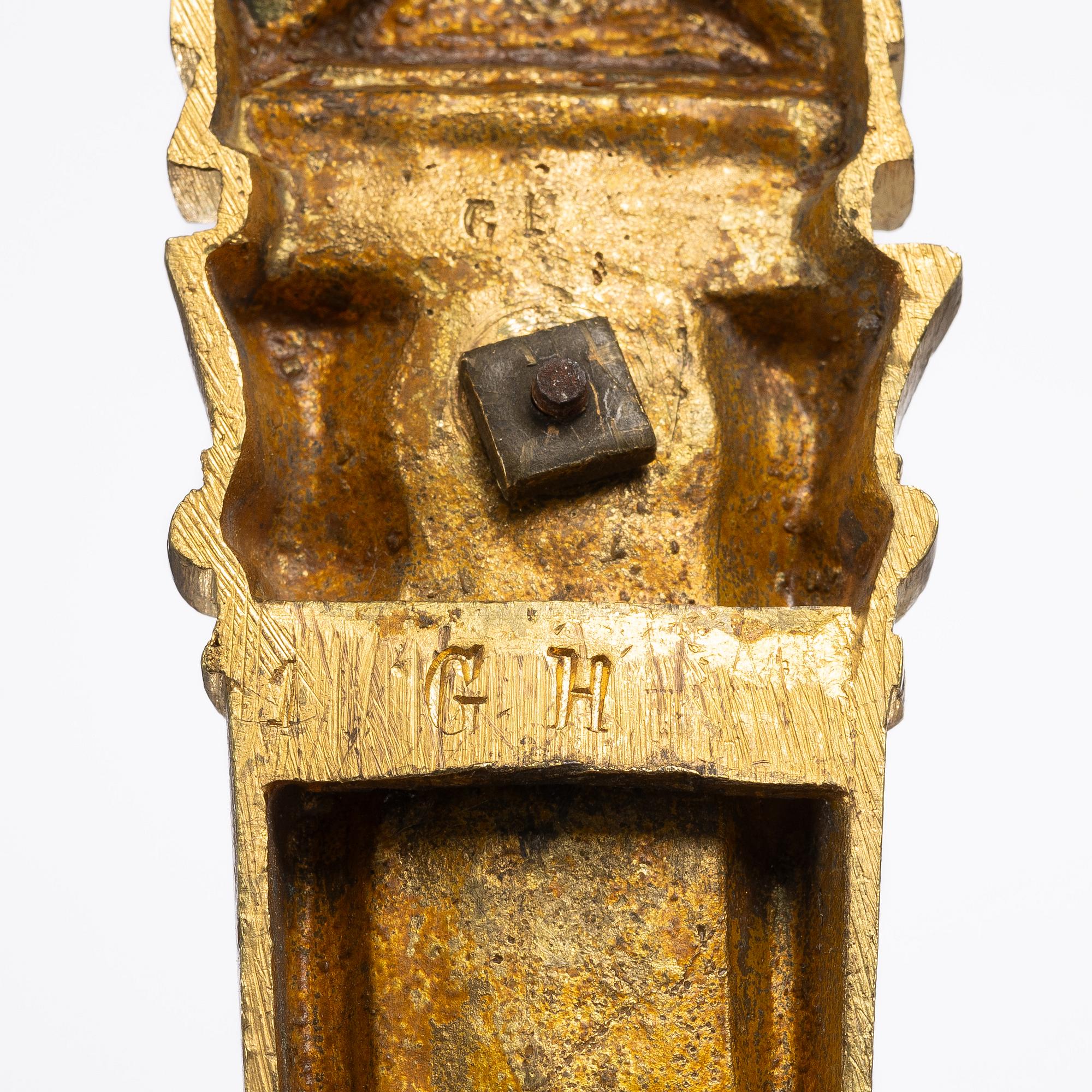 A set of four gilt bronze Louis XVI-style curtain holders, late 19th century.