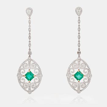 674. A pair of emerald, 2.18 cts /2.71 cts, and diamond earrings.