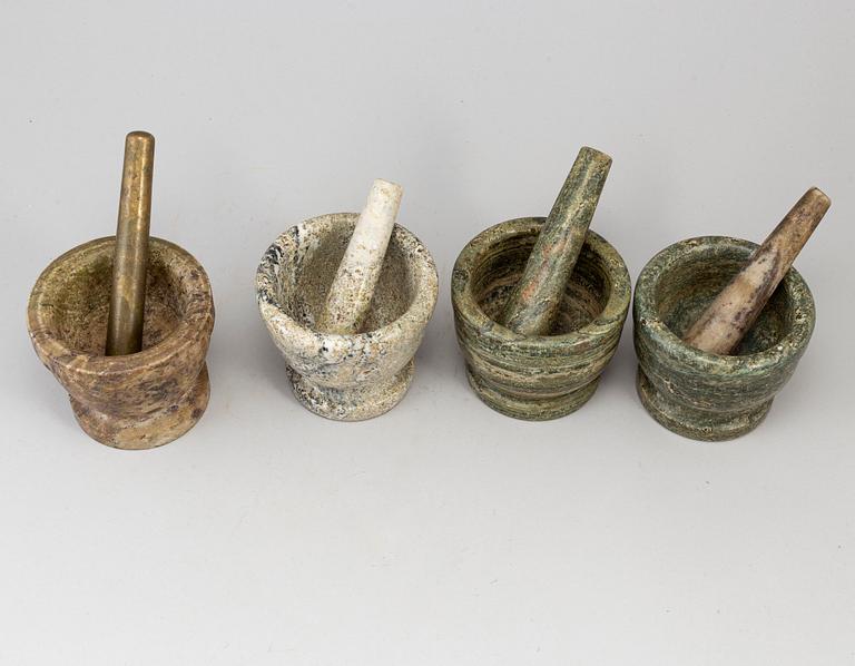 Four swedish green marble mortars and pestles, early 19th century.