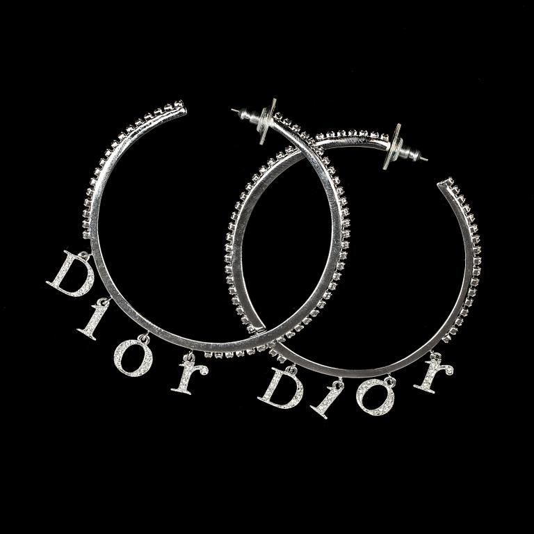 A pair of earrings by Christian Dior.