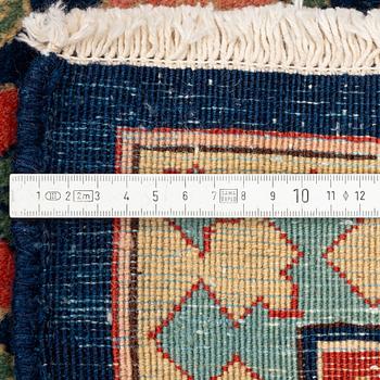 A Tabriz carpet of Harshang design, c. 353 x 250 cm.