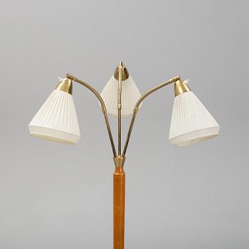 An elm floor light, mid 20th Century.