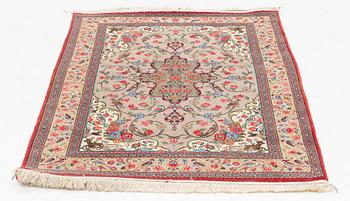 A Ghom rug, c. 160 x 105 cm.