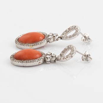 Coral and brilliant cut diamond earrings.