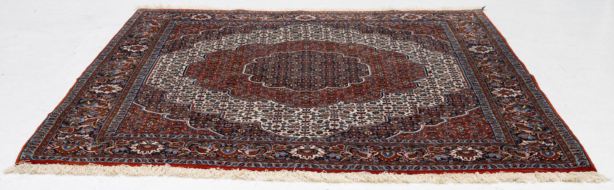 An Oriental rug, approx. 213 x 201 cm.