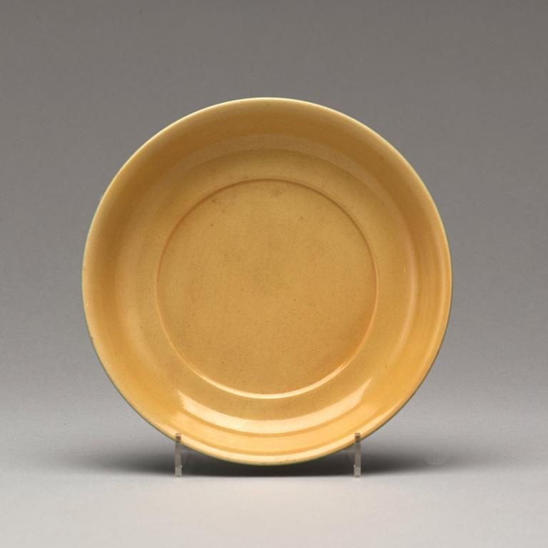 A yellow glazed dish, Ming dynasty, Xuande mark and of the period (1425-35).