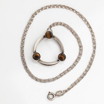 Elis Kauppi, a silver and tiger's eye pendant, Kupittaan Kulta, Turku. With chain in silver.