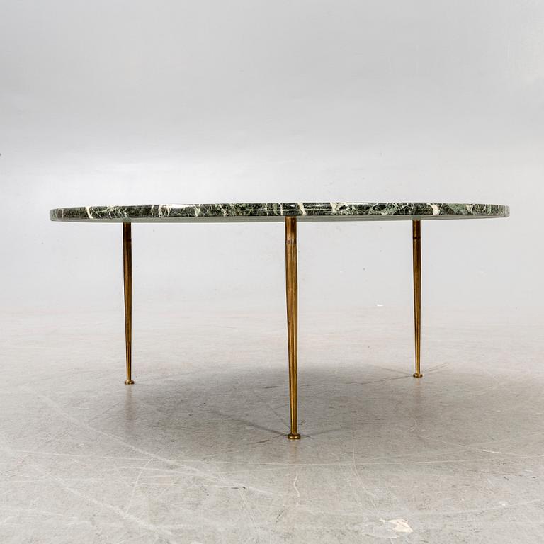 A marble coffee table alter part of the 20th century.