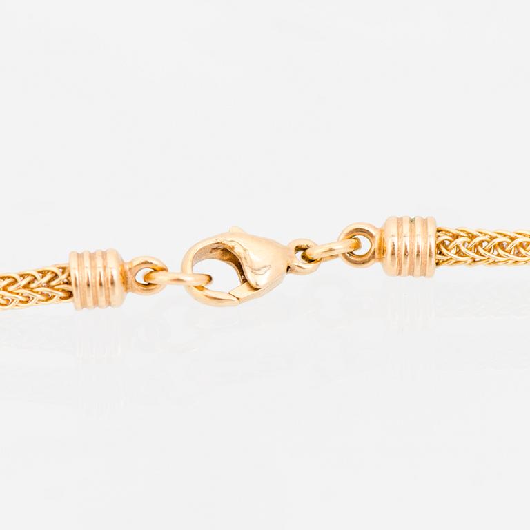 KAULAKORU, "Aurinkoleijona", 18K kultaa. Kalevala Koru 1998.