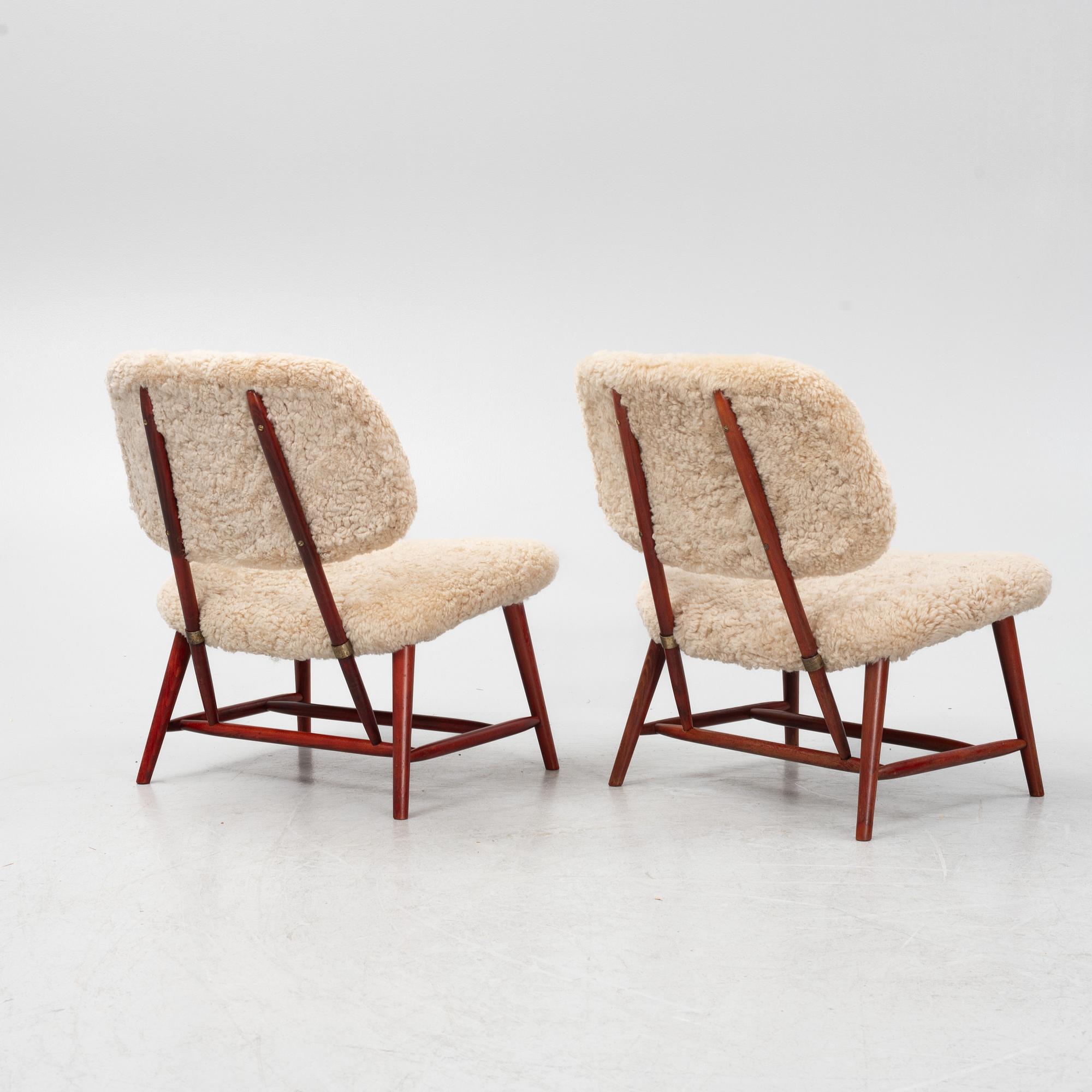 Alf Svensson, a pair of 'TeVe' easy chairs with new sheepskin upholstery, 1950s.