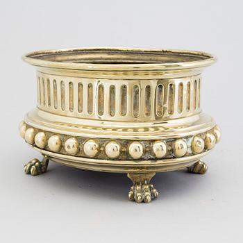 A mid 1800s brass flower pot.