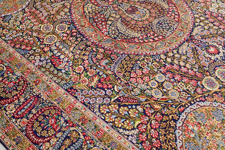 A carpet, Kirman Laver, 'Millefleur', c. 393 x 300 cm.