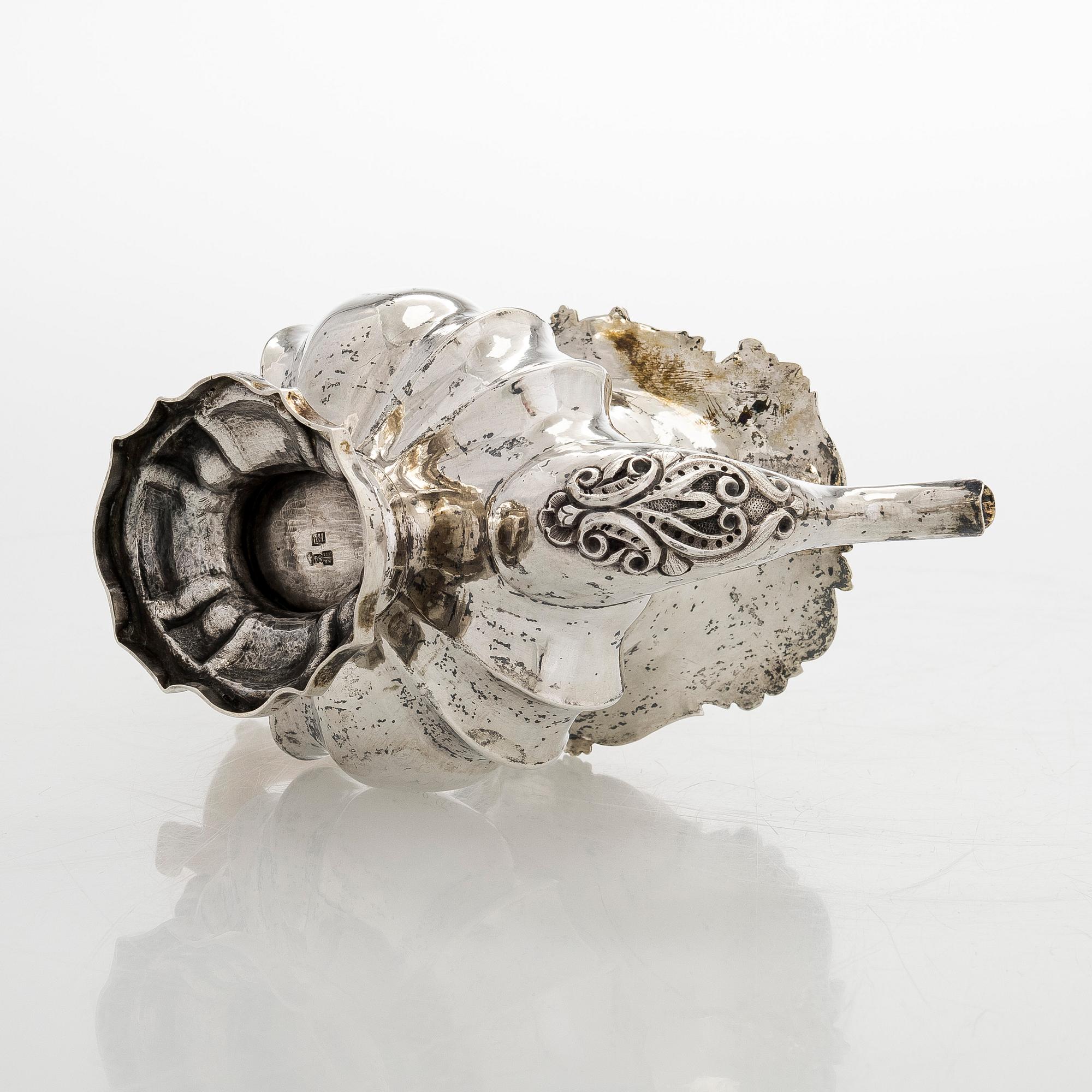 A parcel-gilt silver teapot, Moscow 1845.