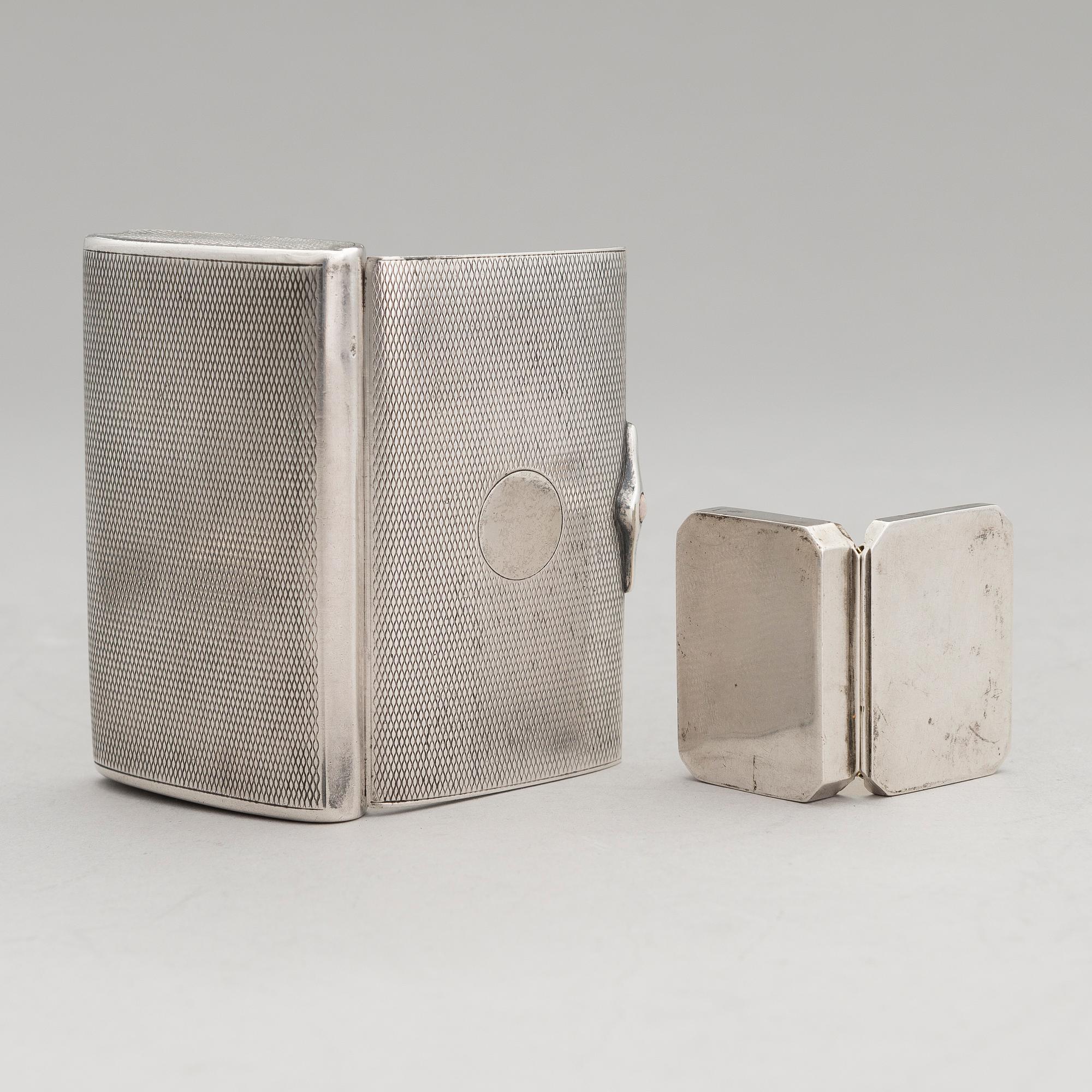 Three silver cigarette cases and a silver pillbox, marked in Finland and Germany, first half of the 20th Century.