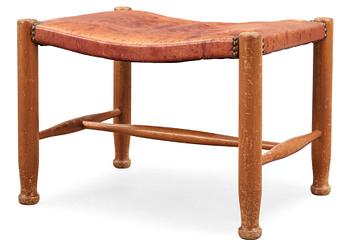 A Josef Frank mahogany and red leather stool, Svenskt Tenn, model 686.
