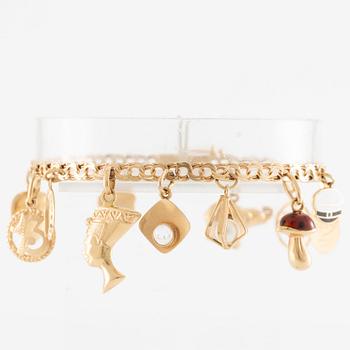 Armband 18K guld med berlocker.