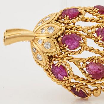 A 1950/60's brooch by Cartier, in the shape of a strawberry, set with carved rubies and brilliant cut diamonds.