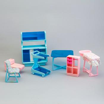 A plastic doll's house with six dolls, furniture and clothes, 20th century.