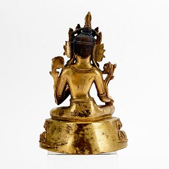 A Tibetochinese patinated bronze Tara figurine 20th century.