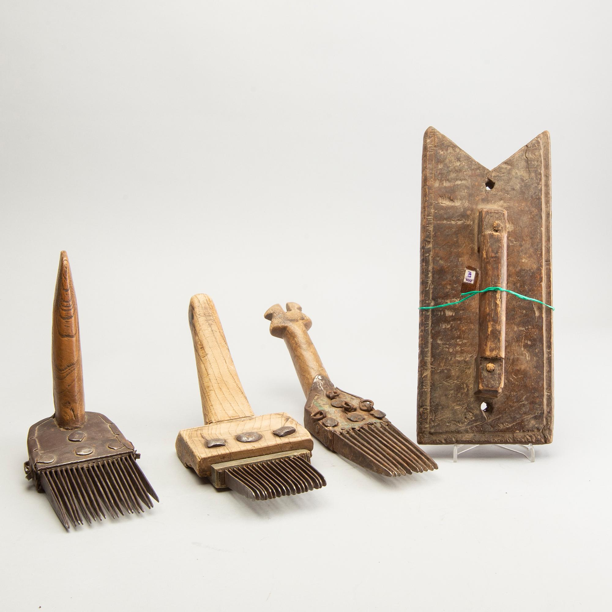 A set of 3 Persian carpet weavers combs and a wood printing block, 20th Century.