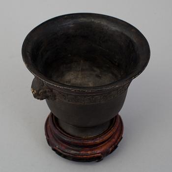 A chinese bronze incense burner and wooden stand, ca 1900s.