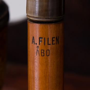 19th century pipes on a wooden pipe rack.
