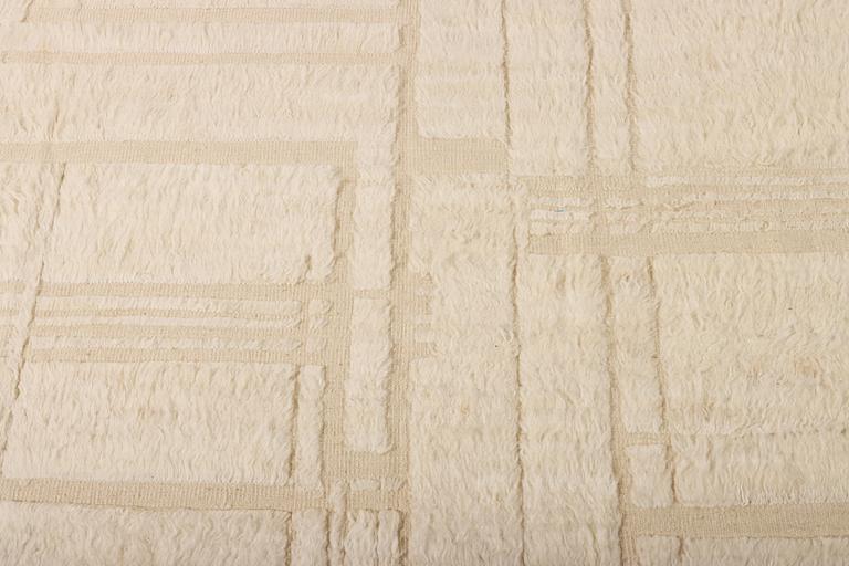 A relief-cut Moroccan carpet, c. 321 x 251 cm.