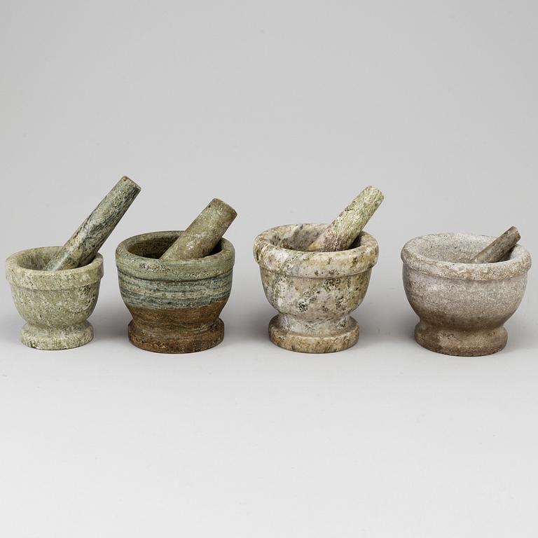 Four Swedish green marble mortars and pestles, early 20th century.