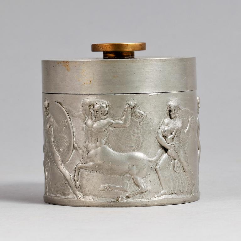 A 1920s pewter can with cover.