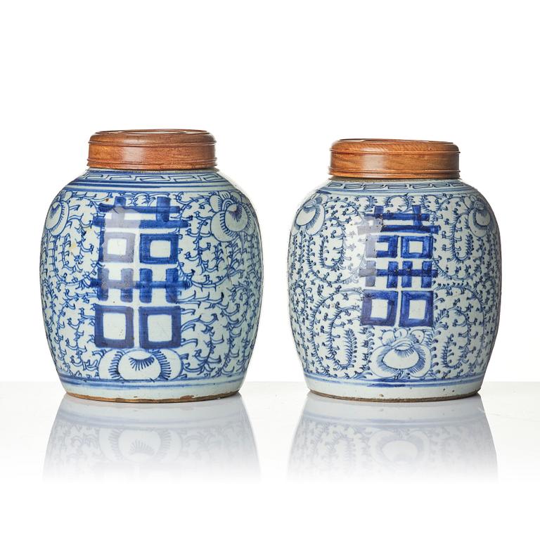 A pair of blue and white porcelain pots with covers, China, 19th century.