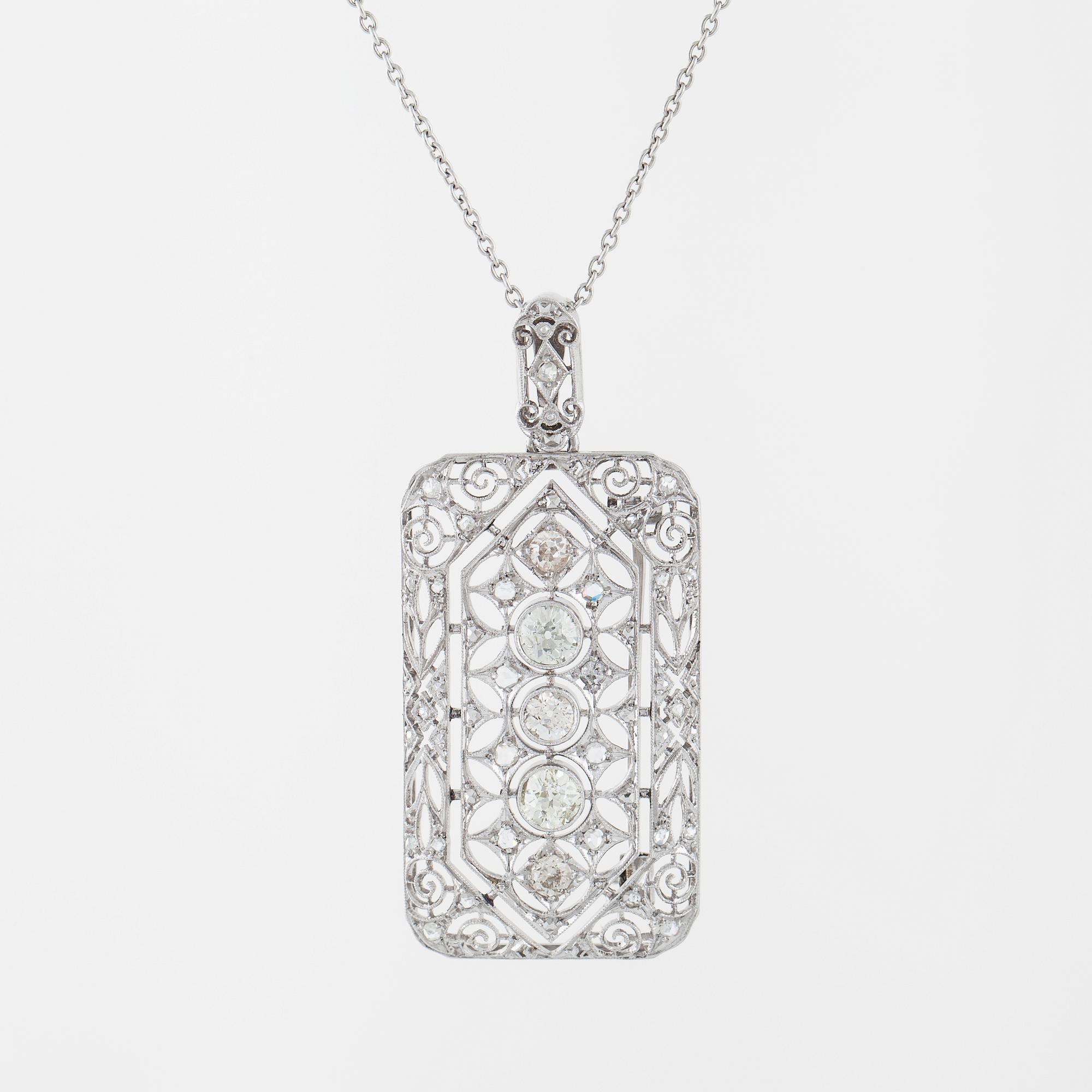 COLLIER/BROSCH, med rosen- och gammalslipade diamanter.