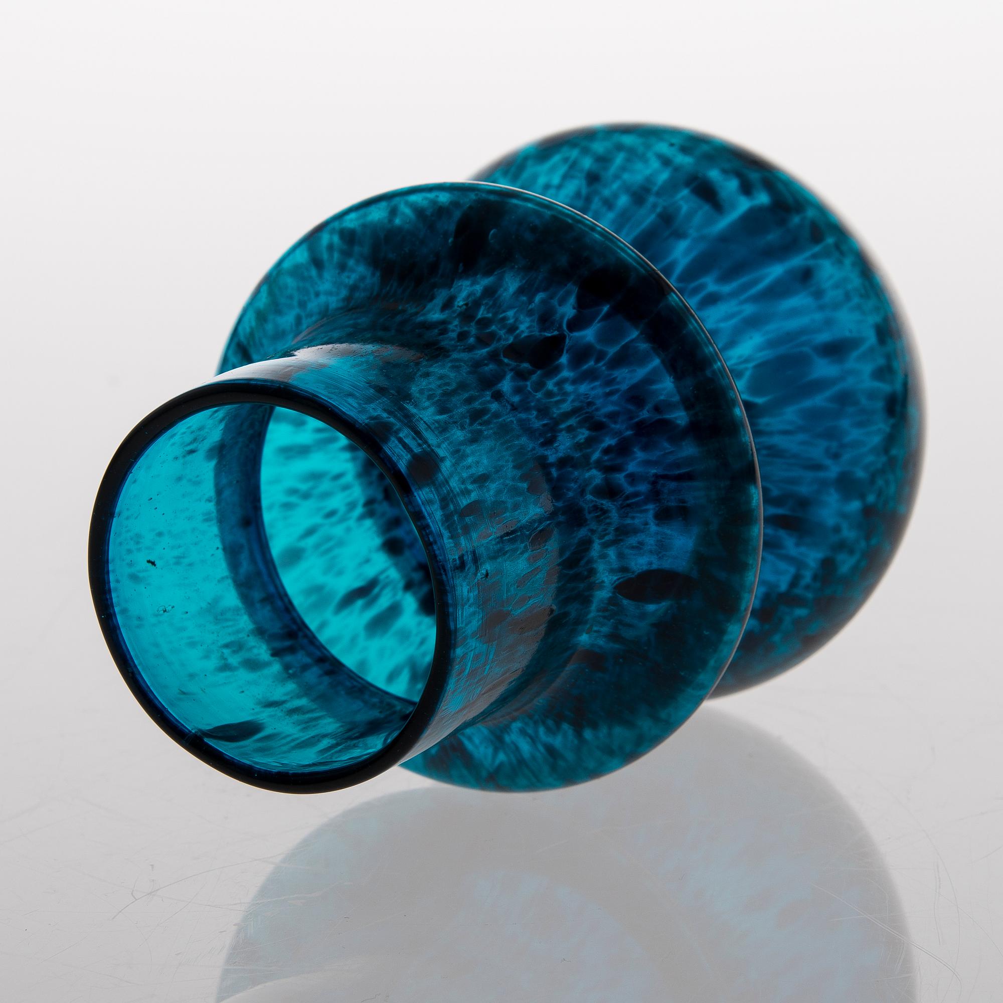a turquoise glass vase.