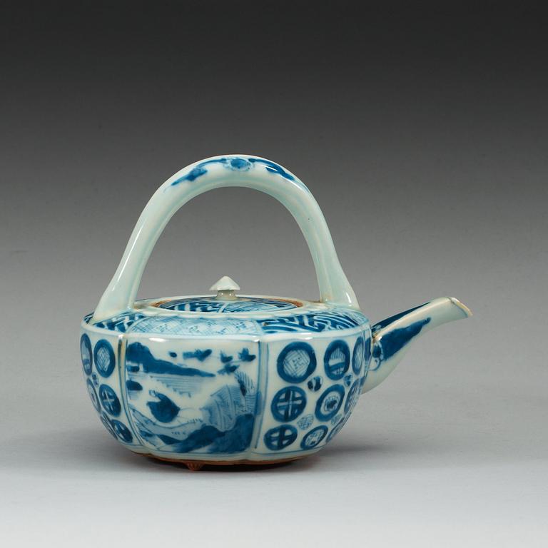 A blue and white Japanese tea pot with cover.