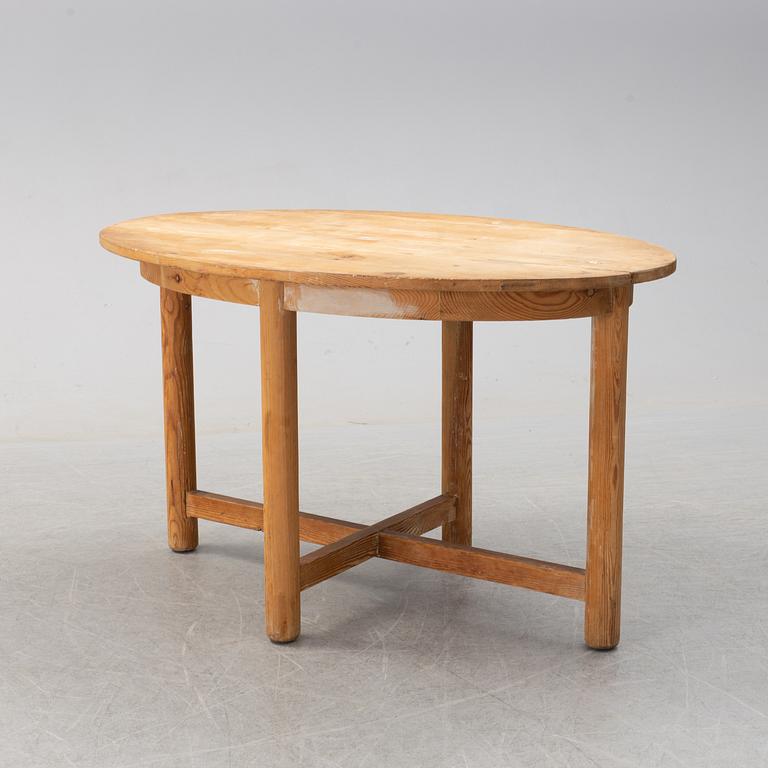 An early 20th century pine table by Nordiska Kompaniet.