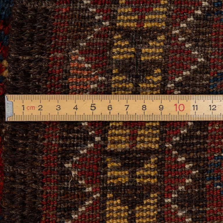 An antique Beshir carpet, ca 495 x 206 cm, around the year 1875.