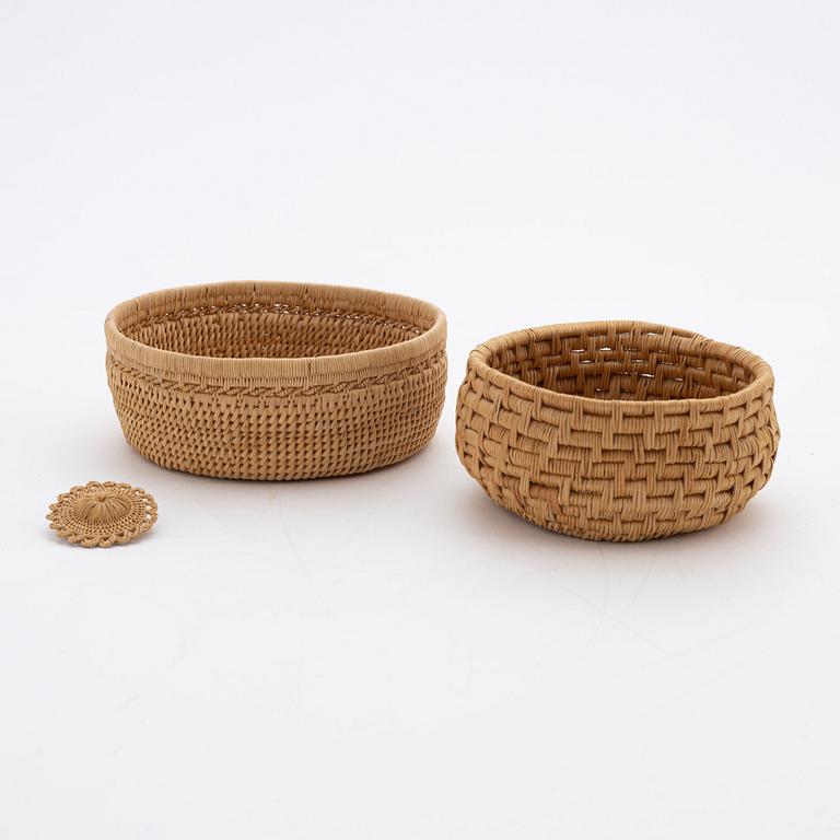 Two baskets and a brooch attributed to Ellen Kitok-Andersson.