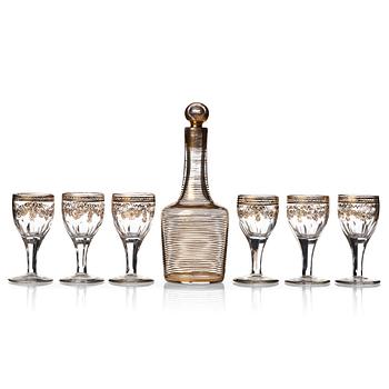 A set of six Russian glass goblets and a bottle with stopper, 19th Century.