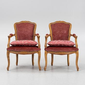 A pair of rococo style armchairs, 20th Century.