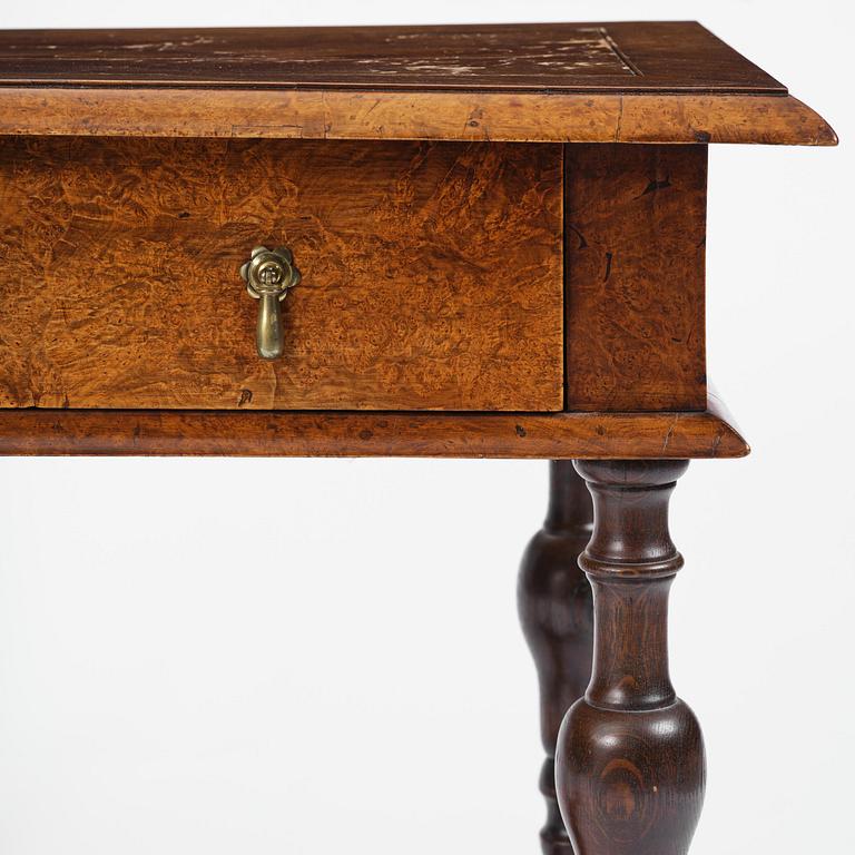 A Swedish late baroque burr-alder table, Stockholm, first part 18th century.