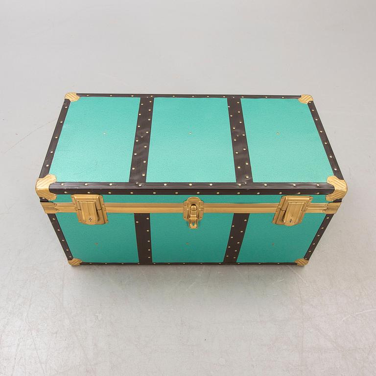 A mid 1900s metal trunk.