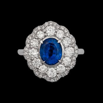 971. An untreated sapphire ring 2.65 cts framed by brilliant cut diamonds, total carat weight circa 1.20 ct.